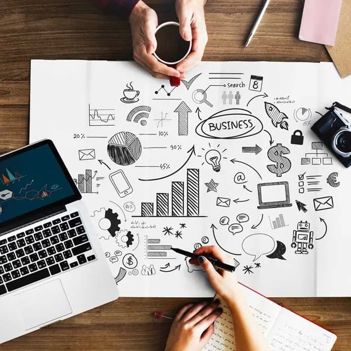 business plan on table and people hands with coffee